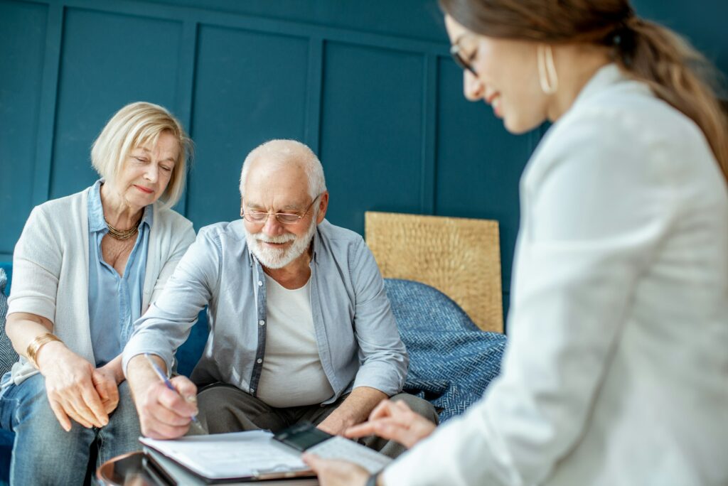 Senior couple with consultant at the office