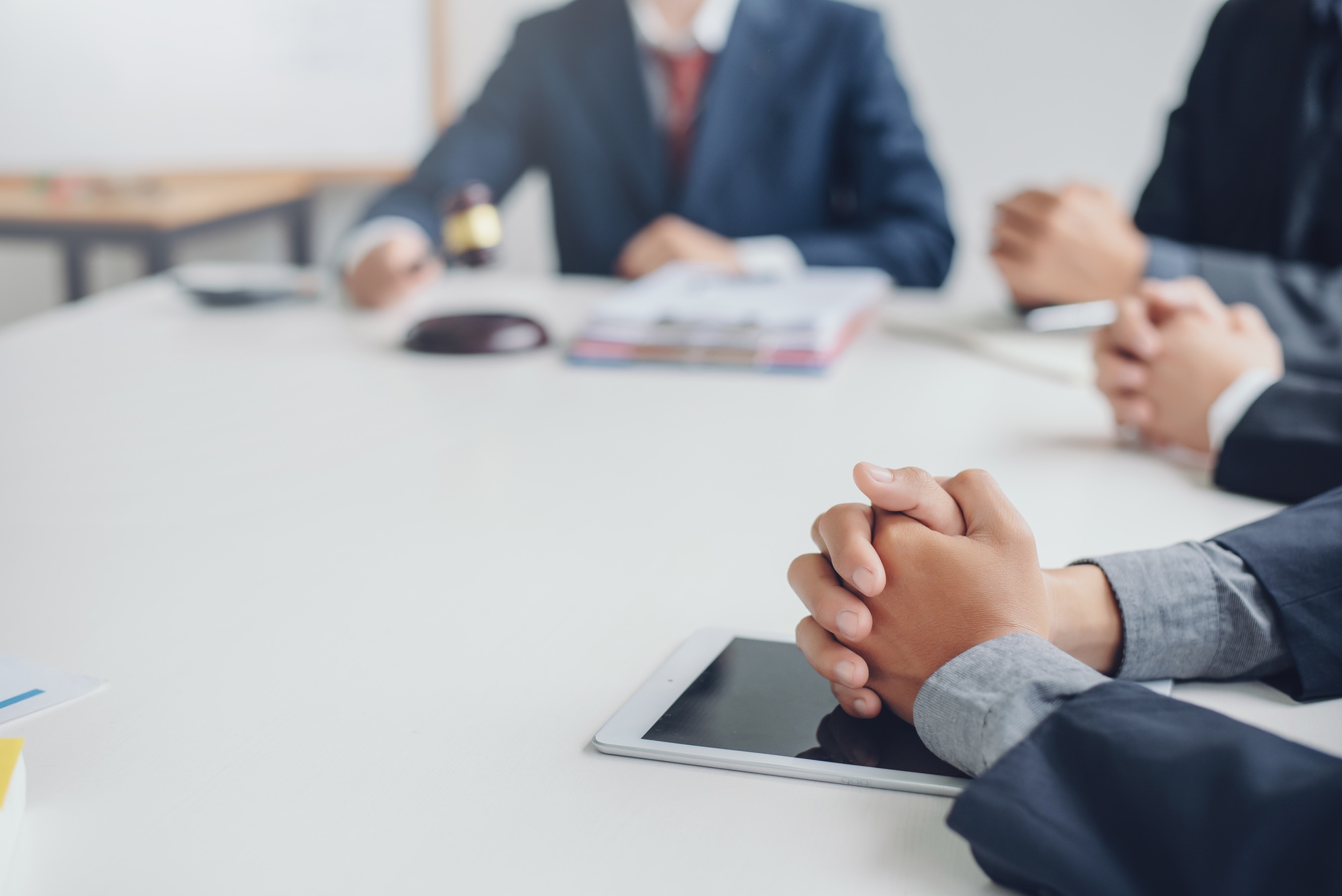 Business lawyer working about legal legislation in courtroom to help their customer.